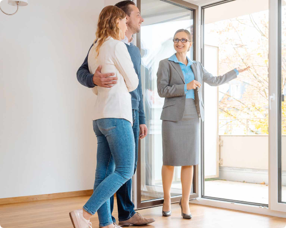 Image of a property manager showing prospective tenants a rental space.