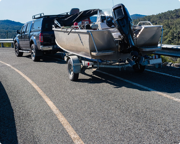 an SUV pulling a boat on a trailer