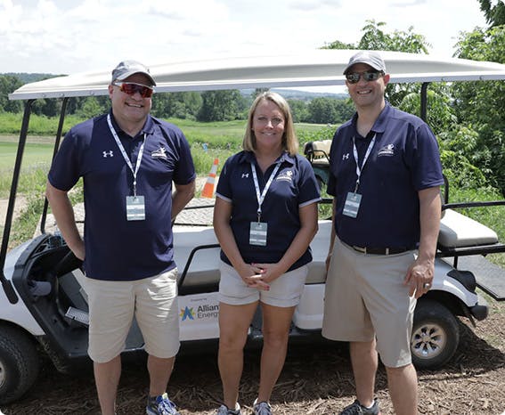 A group of amfam championship volunteers posing for a photo