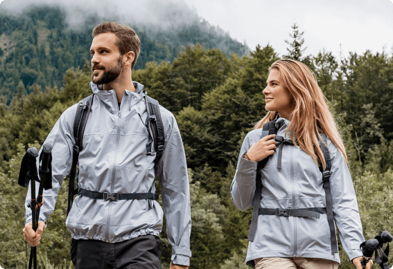 a man and woman with hiking gear