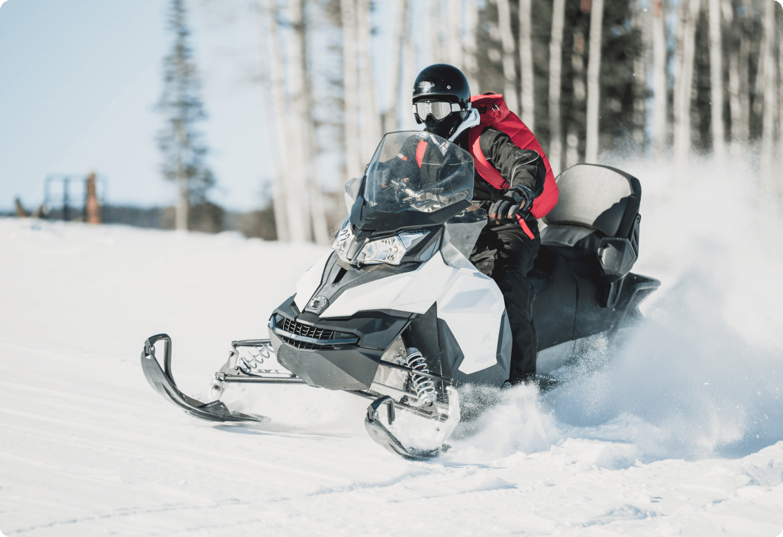 A person riding a snowmobile