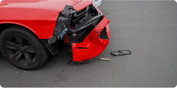 Red car with with front bumper damage