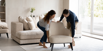 Couple moving furniture