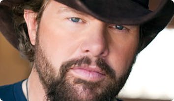 Toby Keith with a beard and mustache