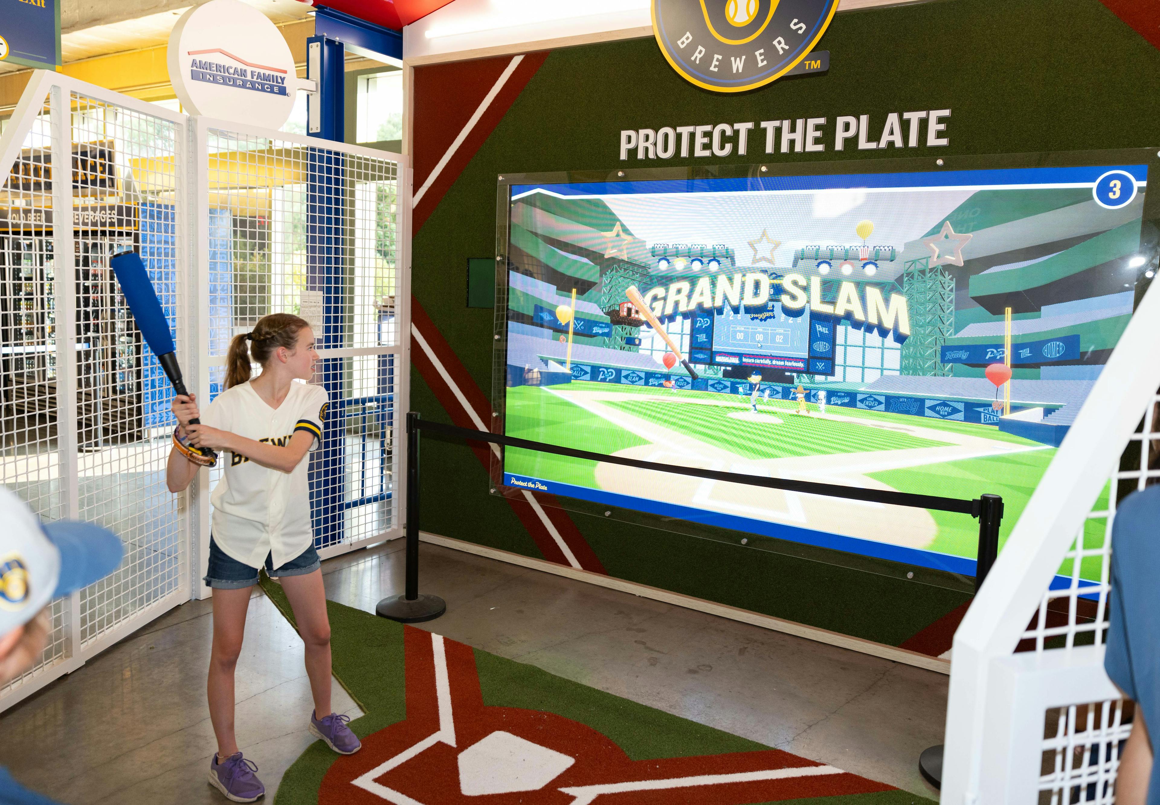 A young girl playing baseball at Protect The Plate