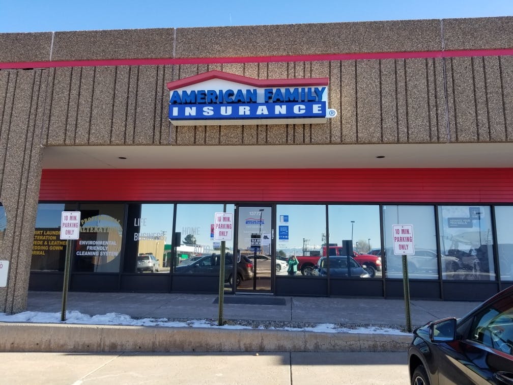 a store front with a blue sign