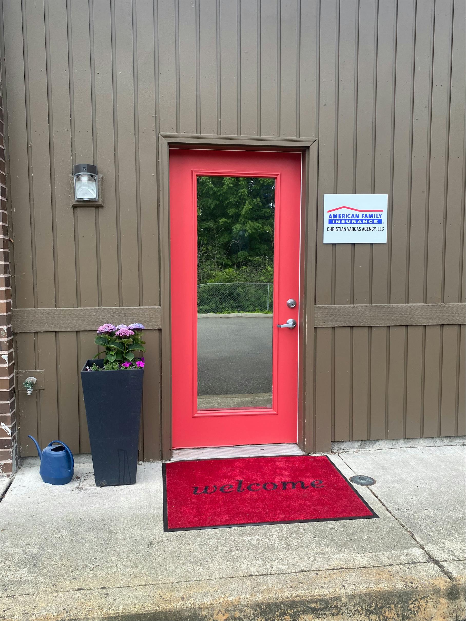 a red door with a sign on it