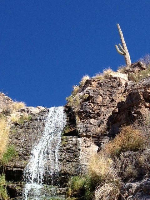 a waterfall over a cliff