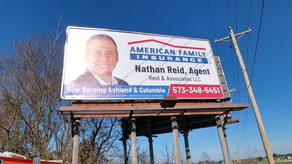 a billboard with a man's face on it