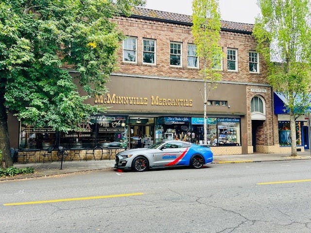 a car parked in front of a store