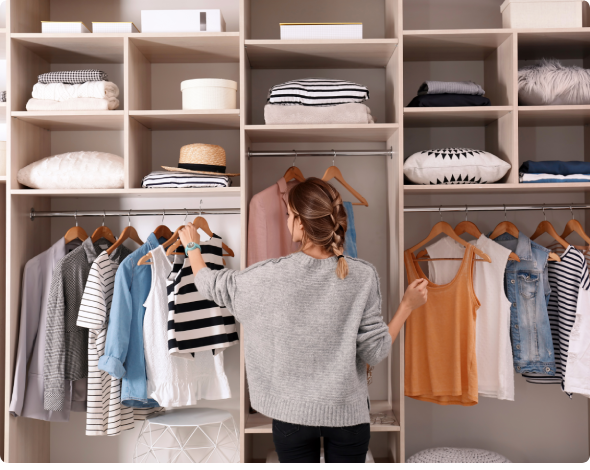 a woman in front of an organized closet