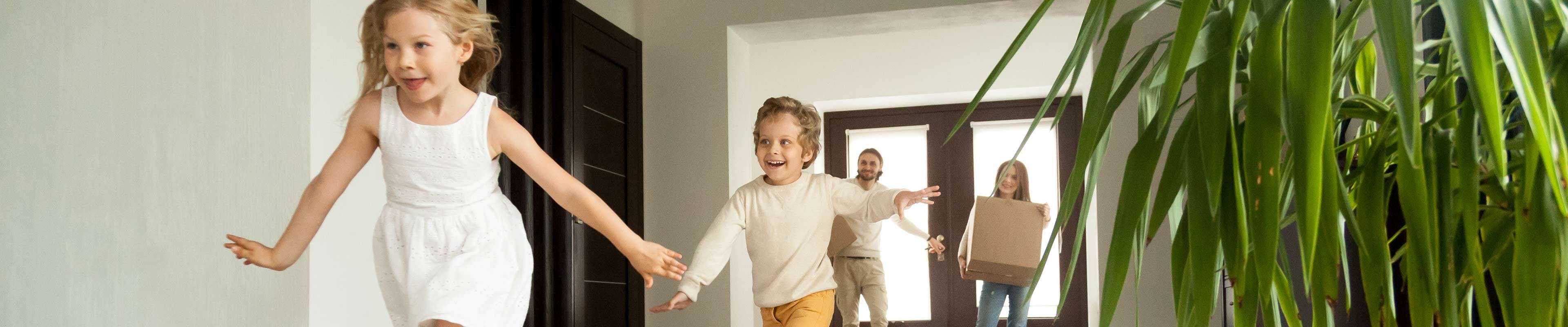 Children running in a new home