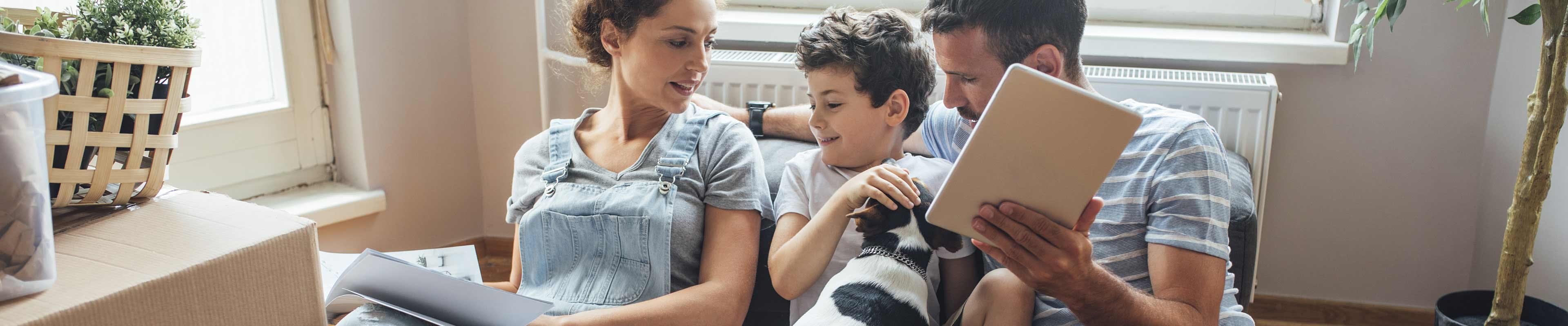 Family of three with dog learning about dog bite insurance.