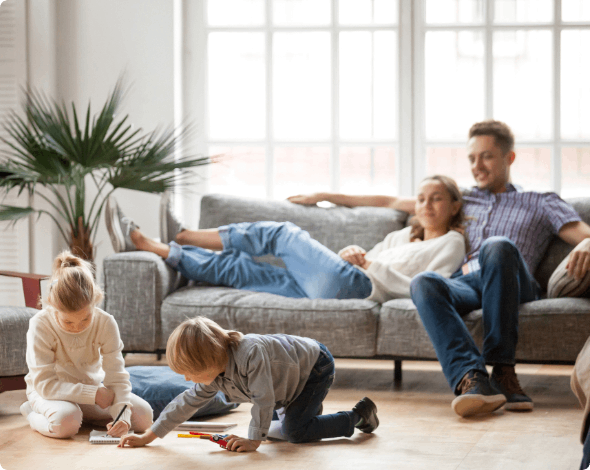 Happy family enjoying their time together in their living room.