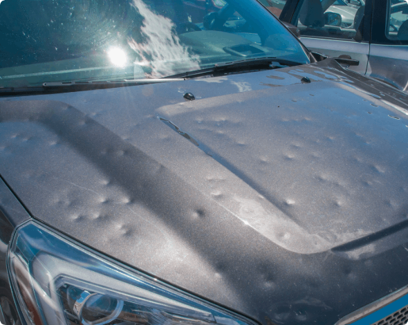 Vehicle with extensive hail damage.
