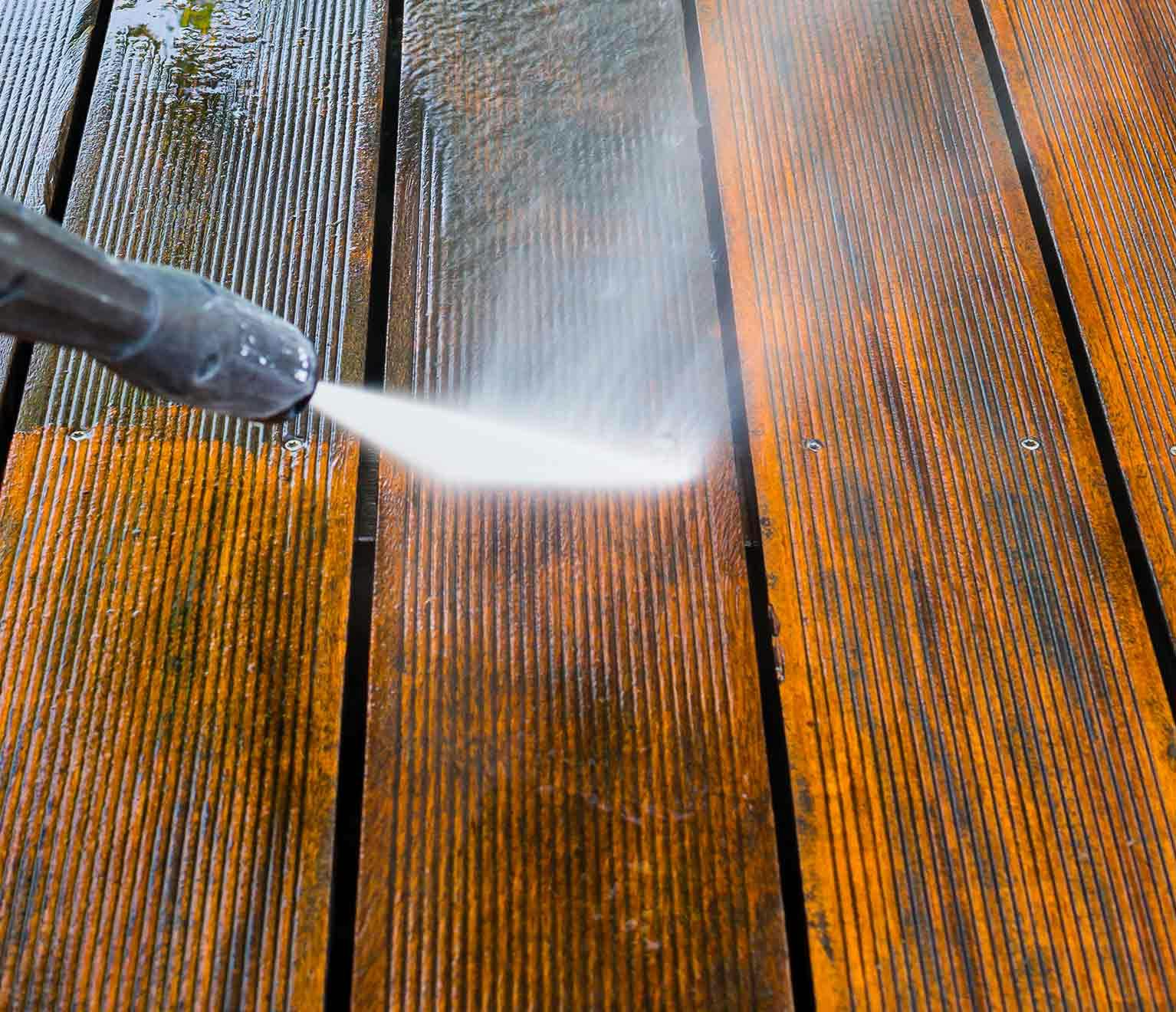 Image of a pressure washer cleaning a household deck.