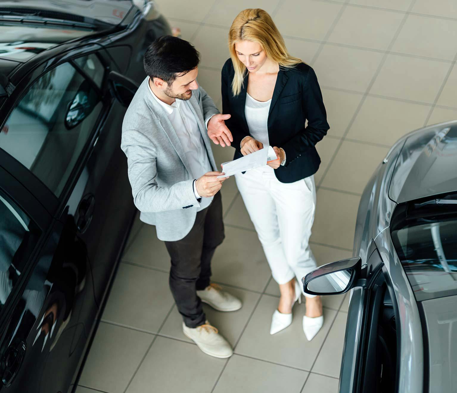 Couple discussing the purchase of a car