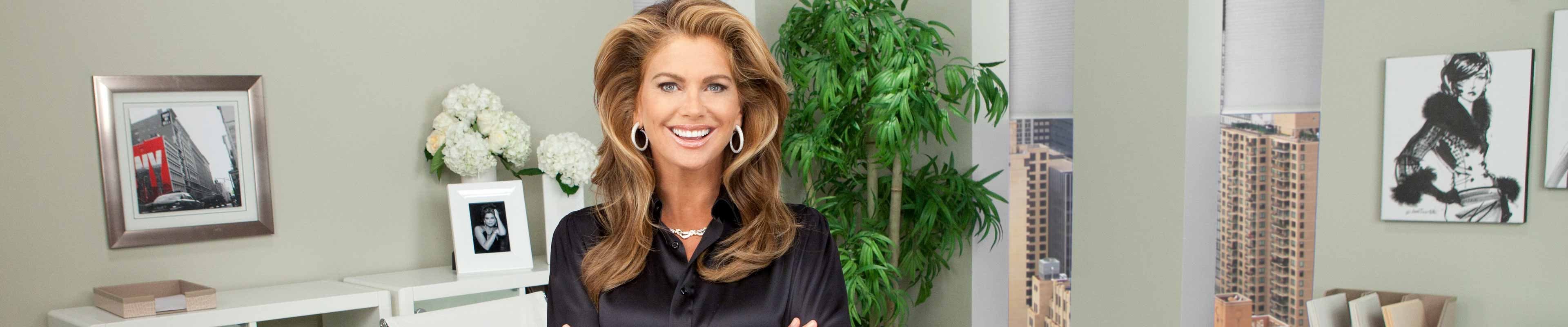Kathy Ireland smiling in a room