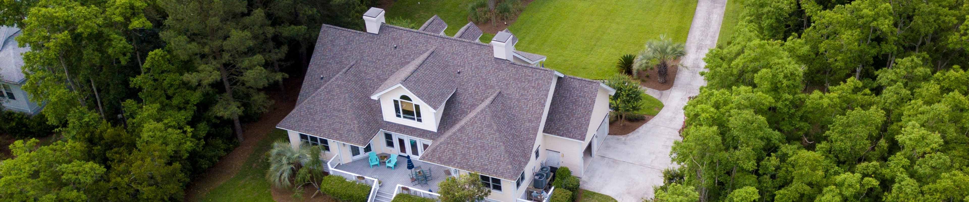 Image of a home and it's shingled roof.