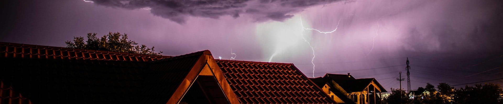 a house with a lightning bolt in the sky