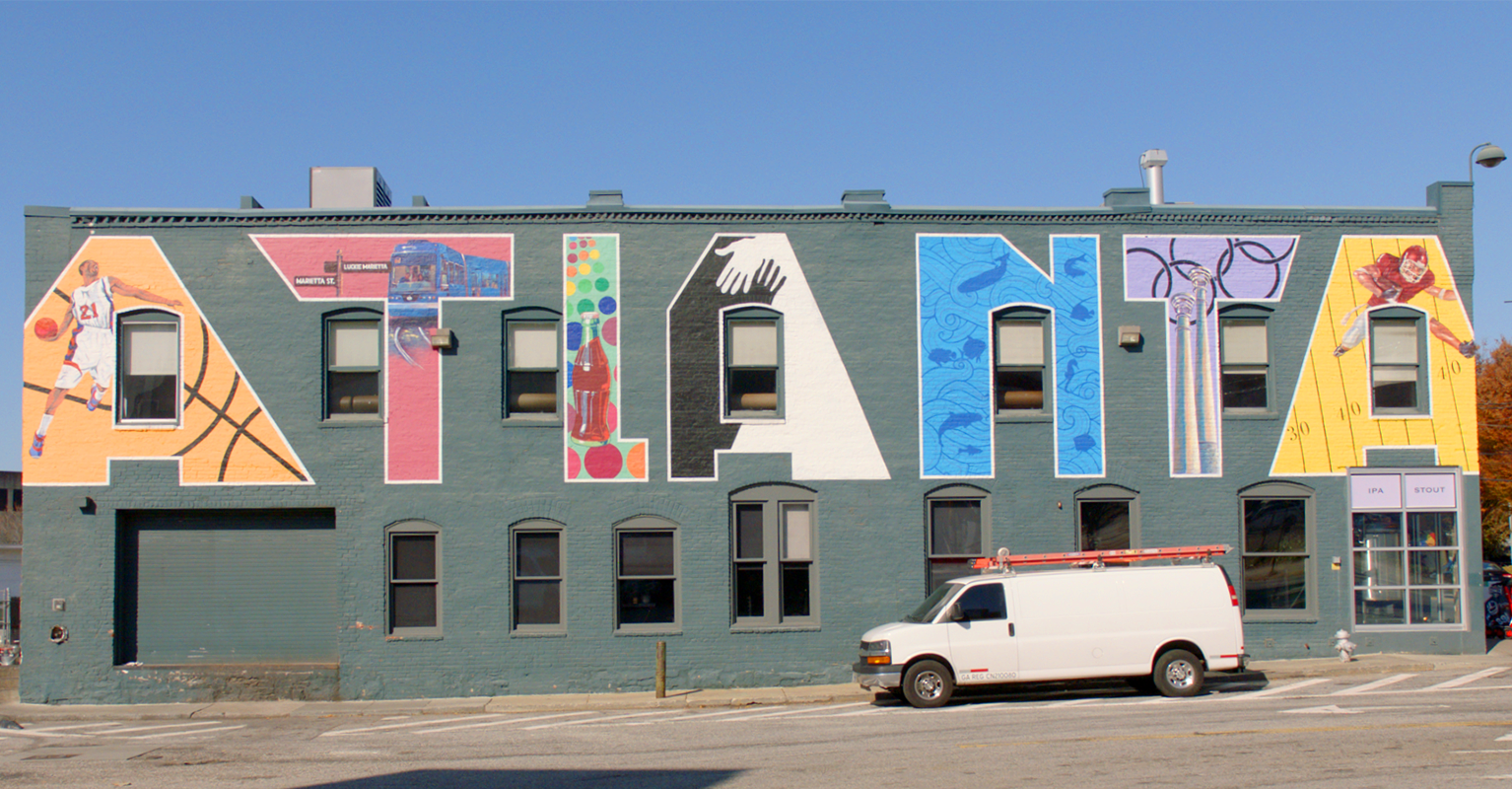 a white van parked in front of a building with colorful graffiti