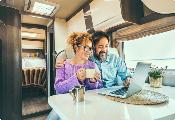 a man and woman sitting in an RV