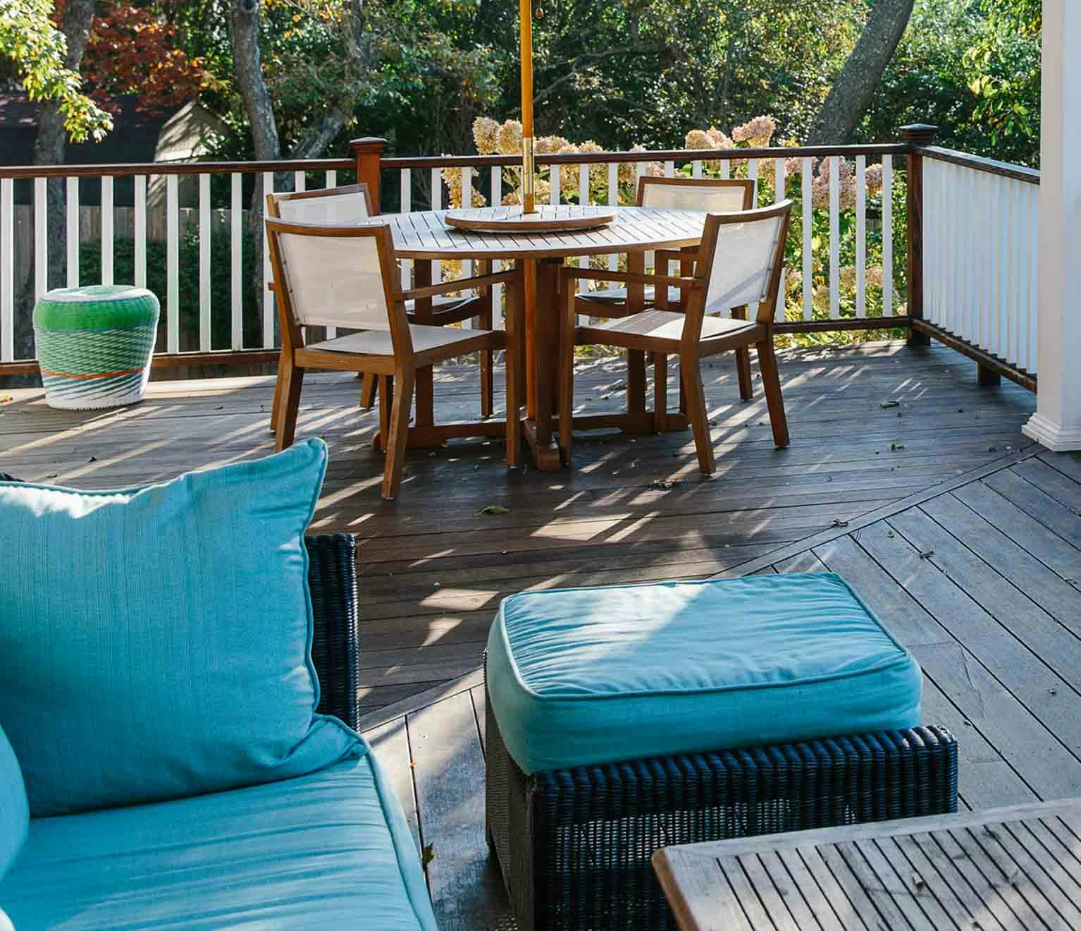a table and chairs on a deck