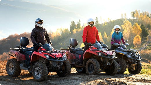 a group of people on atvs