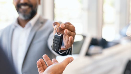 handing keys to car owner