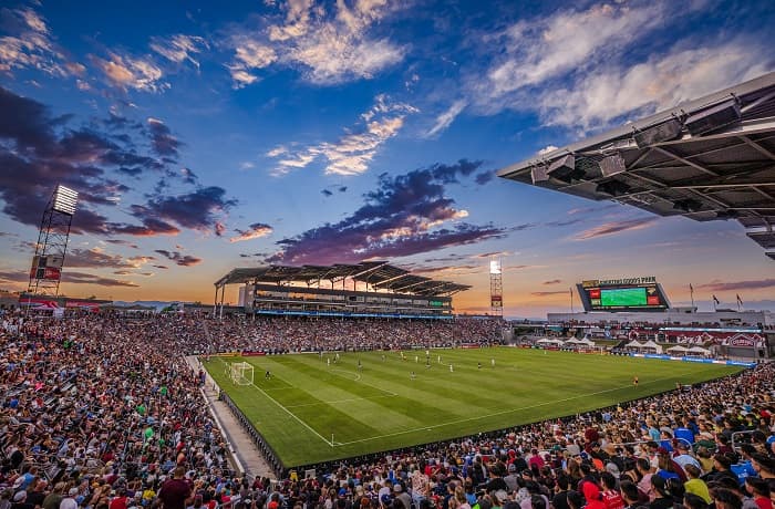 a stadium of fans watching the Rapids play