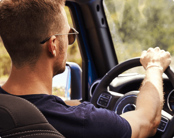man driving a car