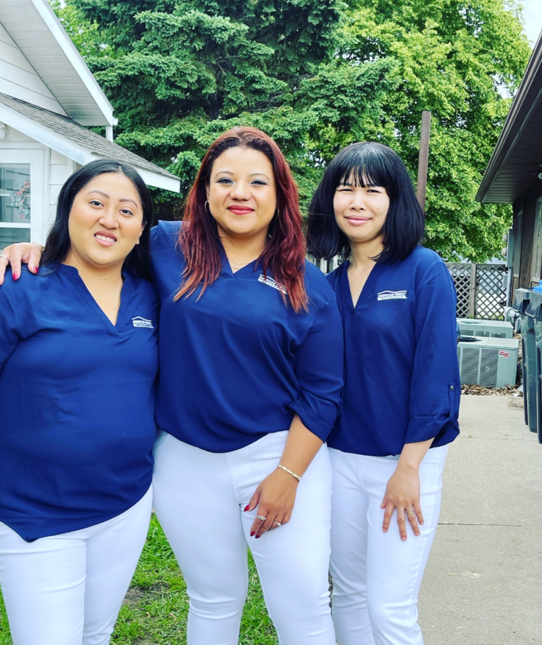 a group of women in matching blue shirts