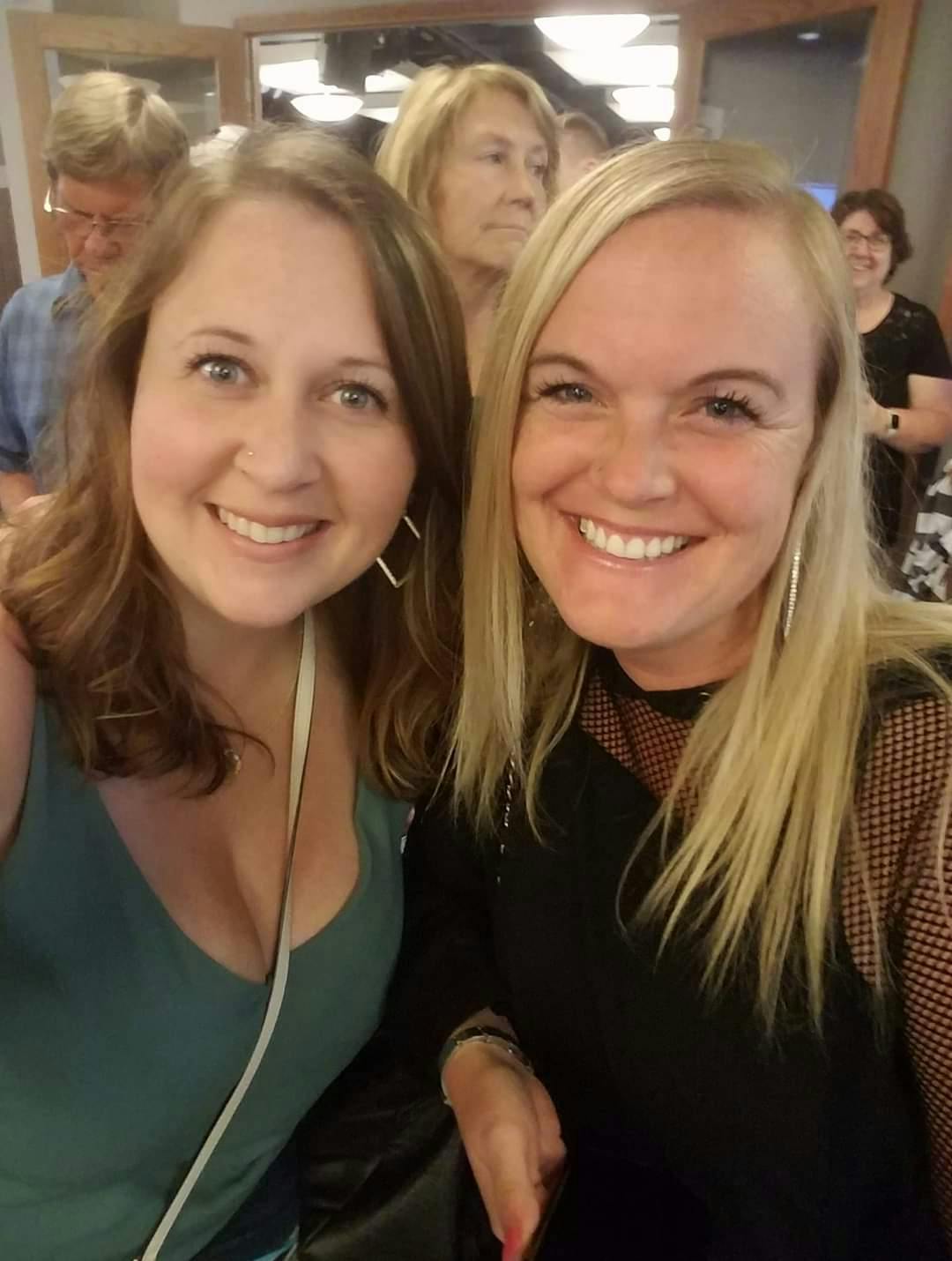a couple of women smiling