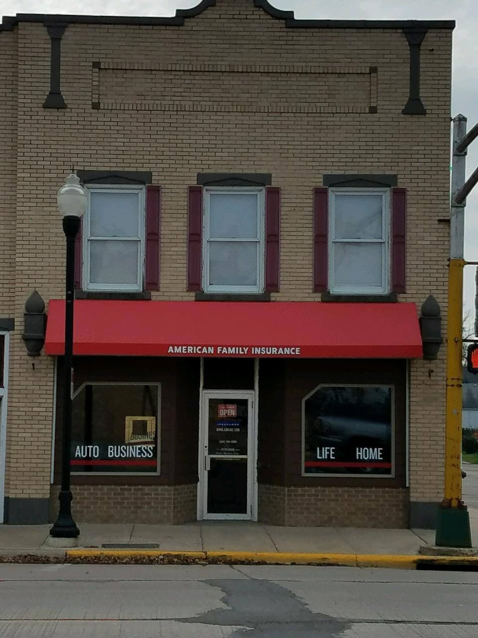 a red building with a sign on the front