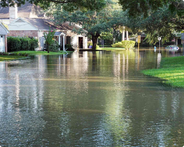 Image of a suburban street with flooding.